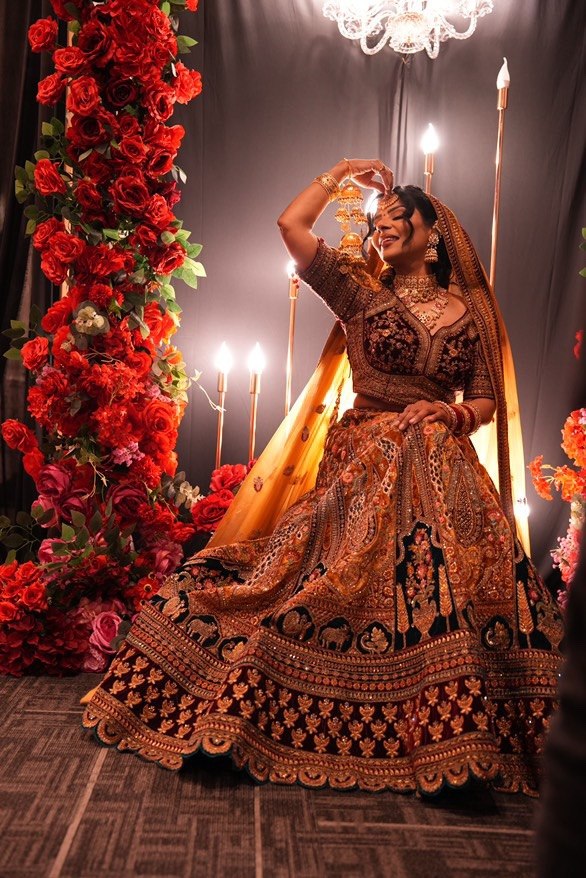 South Asian bride, maroon-gold couture, candlelight