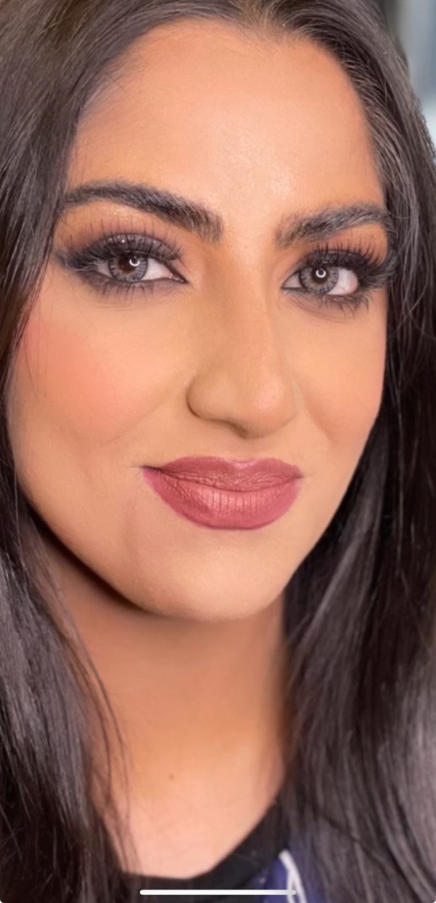Studio close-up, mauve lip, sculpted cheek